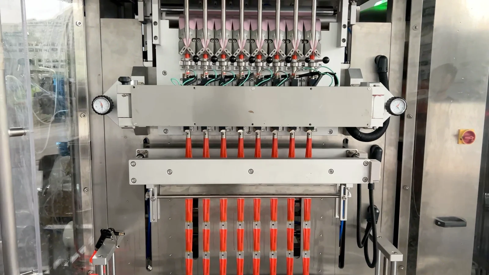 Eight parallel film lanes, forming positions and sealing assemblies, with both outer lanes visible