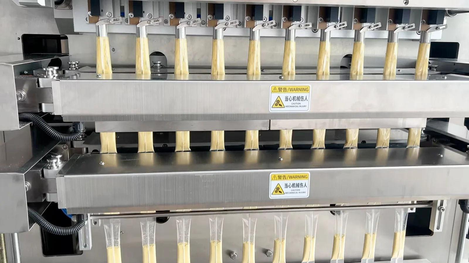 Ten stick-pack film lanes passing through the powder-machine cross-sealing area